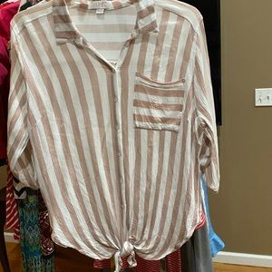 Button down shirt in a gauzy light weight material.